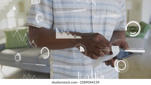 Image of data processing over african american man celaning his smartphone. Global technology, communication, computing and digital interface concept digitally generated image.