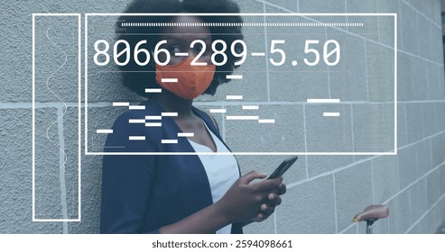 Image of data processing over african american woman wearing face mask and using smartphone. Global communication, computing and digital interface concept digitally generated image. - Powered by Shutterstock - Get 15% off with code: PIKWIZARD15