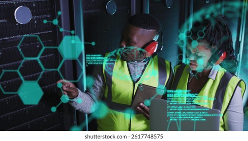 Image of data processing over african american workers in server room. global business, cloud computing and digital interface concept digitally generated image. - Powered by Shutterstock - Get 15% off with code: PIKWIZARD15