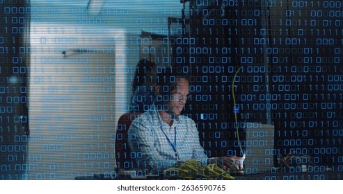 Image of data processing over african american male server room worker using laptop. Cloud computing concept digitally generated image.
