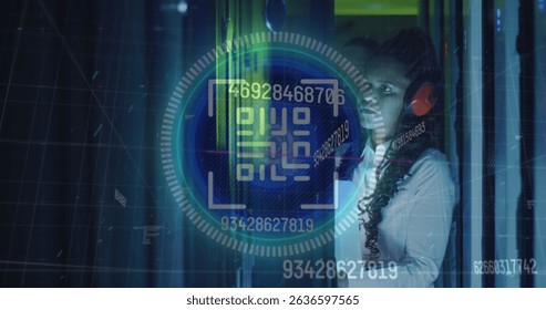 Image of data processing over african american female server room worker using headphones. Cloud computing concept digitally generated image.