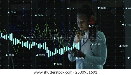 Image of data processing over african america nwoman using headphones in server room. Cloud computing, digital interface and security concept digitally generated image.