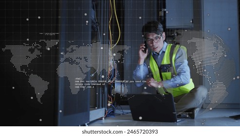 Image of data processing over asian male worker in server room. global business and digital interface concept digitally generated image.
