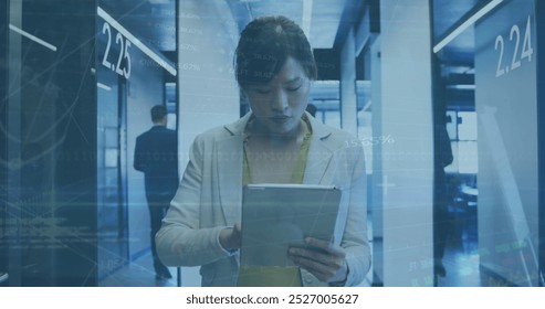 Image of data processing over asian businesswoman using tablet in office. global business, computing and digital interface concept digitally generated image. - Powered by Shutterstock