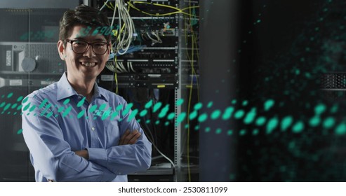 Image of data processing over asian male worker in server room. Global business and digital interface concept digitally generated image.