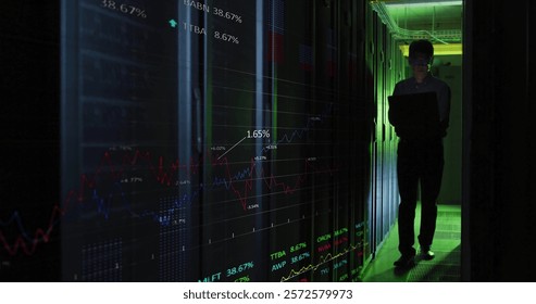 Image of data processing over asian male it engineer by computer servers. Global finance, business, connections, computing and data processing concept digitally generated image.