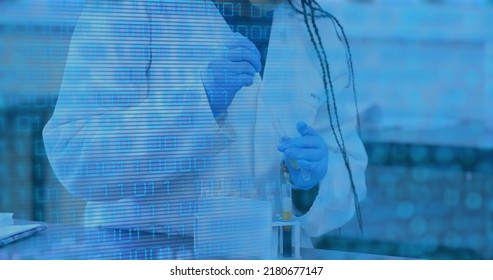 Image of data processing over biracial female scientist in lab. Global science, computing and digital interface concept digitally generated image.