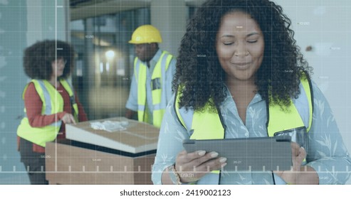 Image of data processing over biracial female engineer in hi vis vest using tablet. Global business, connections, computing and data processing concept digitally generated image.