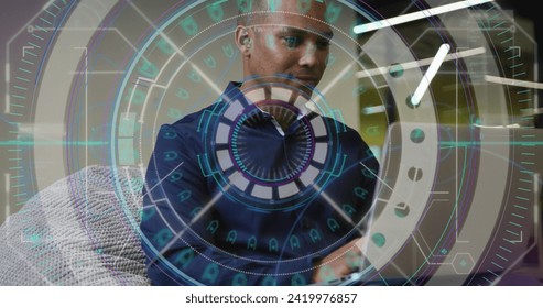 Image of data processing over biracial businessman working in office. Global business, finances, computing and data processing concept digitally generated image.