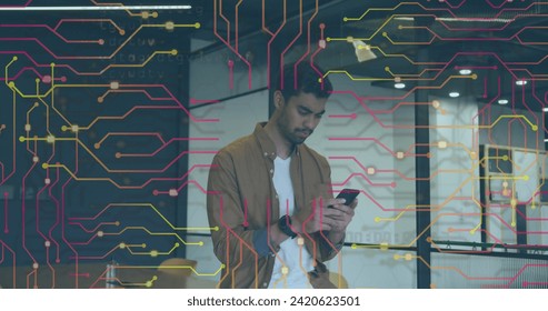 Image of data processing over biracial businessman using smartphone. Global online security, digital interface, computing and data processing concept digitally generated image.