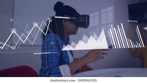 Image of data processing over biracial businesswoman using vr headset. Global artificial intelligence, connections, computing and data processing concept digitally generated image.
