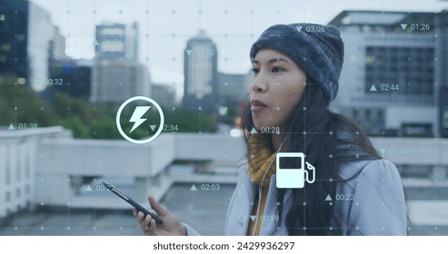 Image of data processing over biracial woman walking with smartphone. Global business, finances and digital interface concept digitally generated image.