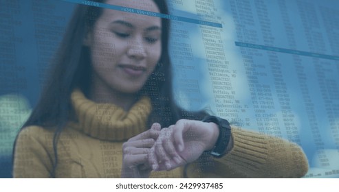 Image of data processing over biracial woman using smartwatch. Global business, finances and digital interface concept digitally generated image.