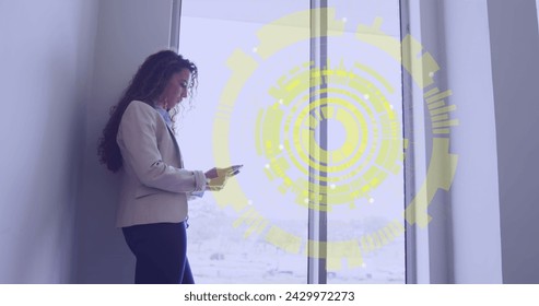 Image of data processing over biracial woman using smartphone. Global business, finances and digital interface concept digitally generated image.