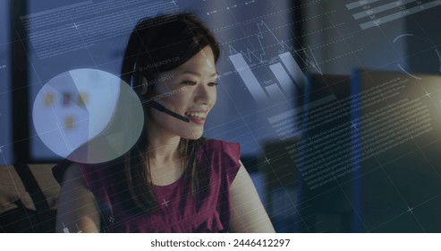 Image of data processing over biracial businesswoman working in office. Global business, finances, computing and data processing concept digitally generated image.
