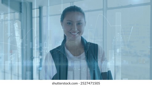 Image of data processing over biracial businesswoman smiling. global business and digital interface concept digitally generated image.