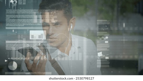 Image of data processing over biracial businessman talking on smartphone. Global business and digital interface concept digitally generated image.