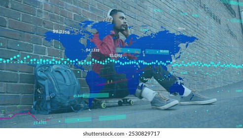 Image of data processing over biracial man wearing headphones. Global business and digital interface concept digitally generated image.