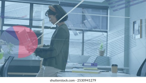 Image of data processing over biracial businesswoman working in office. Global business and digital interface concept digitally generated image. - Powered by Shutterstock