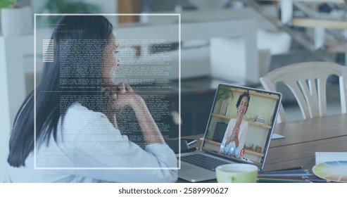 Image of data processing over biracial businesswoman using laptop for image call in office. Global business, finances and digital interface concept digitally generated image. - Powered by Shutterstock - Get 15% off with code: PIKWIZARD15