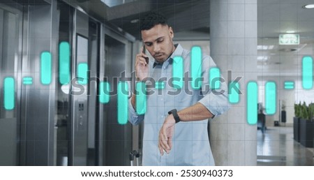 Image of data processing over biracial businessman in office. Global business and digital interface concept digitally generated image.