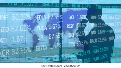 Image of data processing over businessman using smartphone. Global business and digital interface concept digitally generated image.