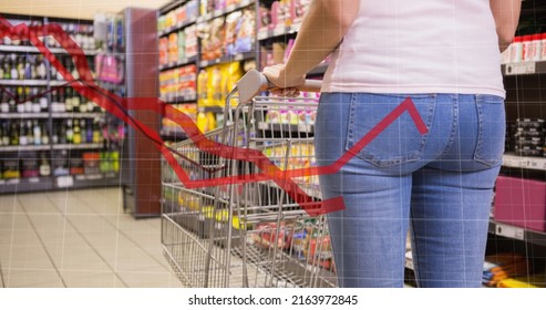 Image of data processing over caucasian woman with trolley in shop. global business, shopping and digital interface concept digitally generated image.