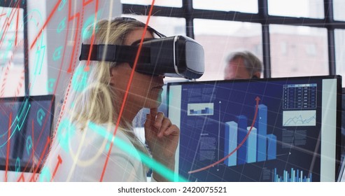 Image of data processing over caucasian businesswoman using vr headset in office. Global business, finances, computing and data processing concept digitally generated image.