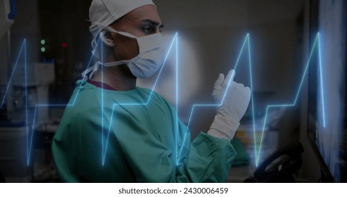 Image of data processing over caucasian male surgeon in hospital. Global medicine, healthcare, connections, computing and data processing concept digitally generated image.