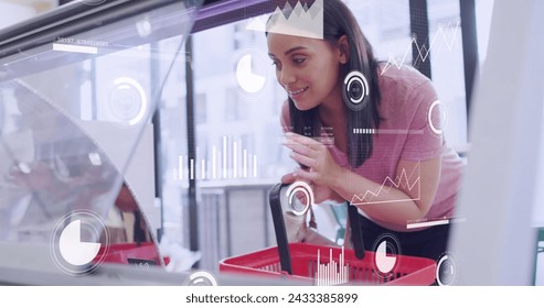 Image of data processing over caucasian female customer shopping. Global business and digital interface concept digitally generated image. - Powered by Shutterstock