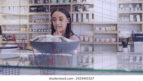 Image of data processing over caucasian female customer shopping. Global business and digital interface concept digitally generated image.