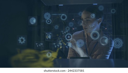 Image of data processing over caucasian female it engineer with tablet checking computer servers. data processing, cloud computing concept and technology concept digitally generated image.
