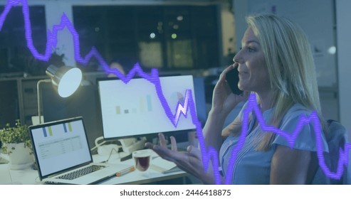 Image of data processing over caucasian businesswoman working in office. Global business, finances, computing and data processing concept digitally generated image.