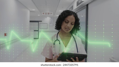 Image of data processing over caucasian biracial doctor in hospital. Global healthcare, science, medicine, research, computing and data processing concept digitally generated image.