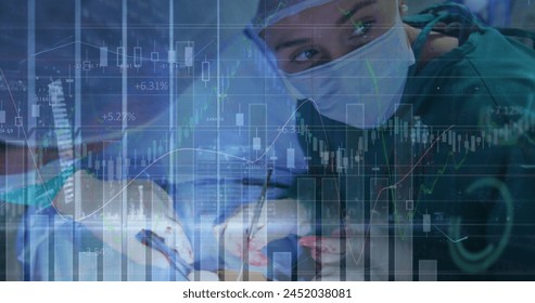Image of data processing over caucasian female surgeon performing operation at hospital. Medical healthcare and technology concept