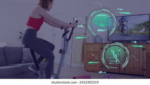 Image of data processing over caucasian woman exercising, using stationary bike at home. Global fitness, digital interface and connections concept digitally generated image.
