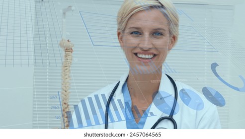 Image of data processing over caucasian female doctor smiling. global medicine and digital interface concept digitally generated image.