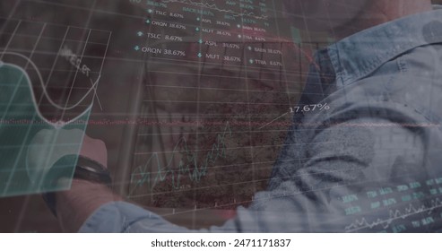 Image of data processing over caucasian man with smartwatch. Global business and digital interface concept digitally generated image. - Powered by Shutterstock