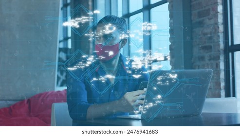 Image of data processing over caucasian businessman wearing mask using smartphone. Digital composite, multiple exposure, covid, business, futuristic and technology concept. - Powered by Shutterstock