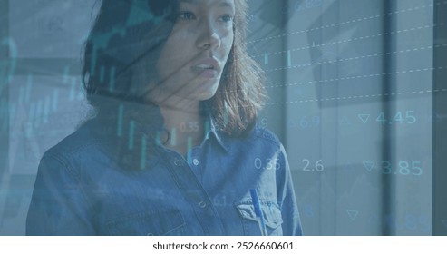 Image of data processing over caucasian businesswoman in office. Global business and digital interface concept digitally generated image.