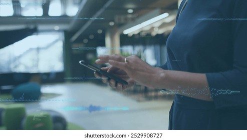 Image of data processing over caucasian businesswoman using smartphone. Business, communication, technology, computing and digital interface concept digitally generated image.