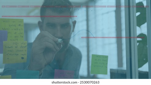 Image of data processing over caucasian businessman taking notes. global business, finances, connections and digital interface concept digitally generated image.