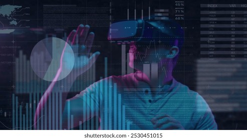 Image of data processing over caucasian man using vr headset. Global business and digital interface concept digitally generated image.