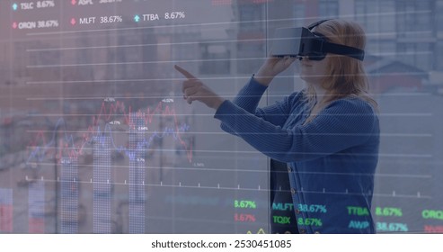 Image of data processing over caucasian woman using vr headset. Global business and digital interface concept digitally generated image.