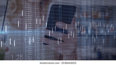 Image of data processing over caucasian woman using smartphone. Global business and digital interface concept digitally generated image. - Powered by Shutterstock