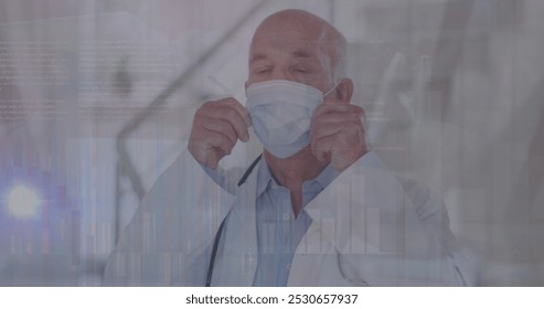 Image of data processing over caucasian male doctor with face mask. global medicine and data processing during covid 19 pandemic concept digitally generated image. - Powered by Shutterstock - Get 15% off with code: PIKWIZARD15