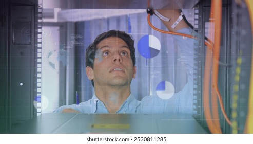 Image of data processing over caucasian male worker in server room. Global business and digital interface concept digitally generated image.