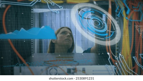Image of data processing over caucasian female engineer connecting wires. computers, network, data processing, technology and digital interface concept digitally generated image.