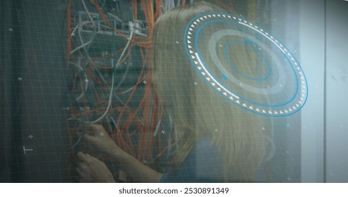 Image of data processing over caucasian female engineer connecting wires. computers, network, data processing, technology and digital interface concept digitally generated image.