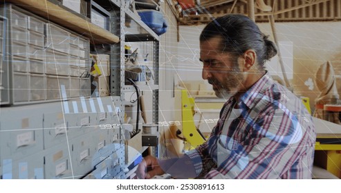 Image of data processing over caucasian male carpenter working in workshop. Global communication, work and digital interface concept digitally generated image.